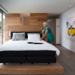 luxury bedroom in wood with butterflies in begur costa brava